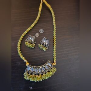 Indian-style jewelry set featuring a necklace and matching earrings